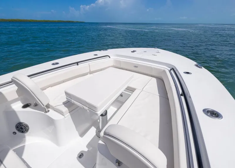 Slide: The Image of 2026 Sea Hunt Gamefish 27 Forward Seating boat on open water, featuring spacious seating area. - 4