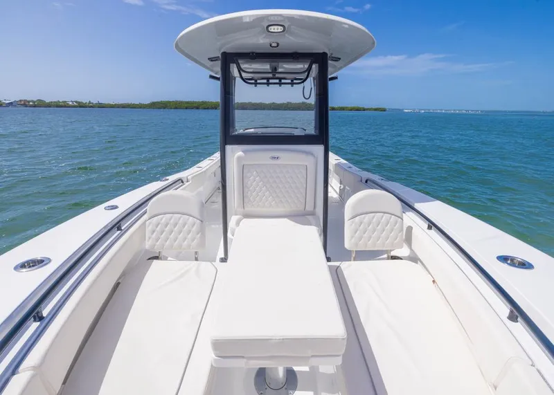 Slide: The Image of 2026 Sea Hunt Gamefish 27 Forward Seating boat on calm blue water. - 5