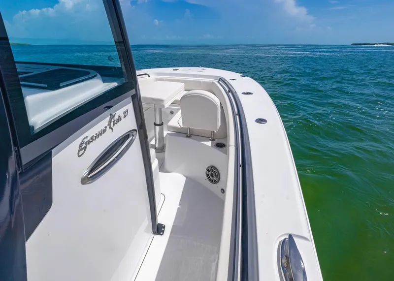 Slide: The Image of 2026 Sea Hunt Gamefish 27 boat with forward seating on open water. - 7