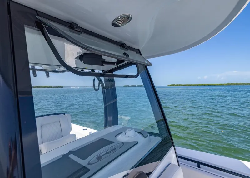 Slide: The Image of 2026 Sea Hunt Gamefish 27 boat with forward seating on open water. - 9