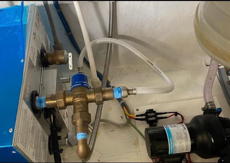 Slide: The Image of Engine room plumbing and wiring of a 1998 Hatteras 39 Sport Express boat. - 20