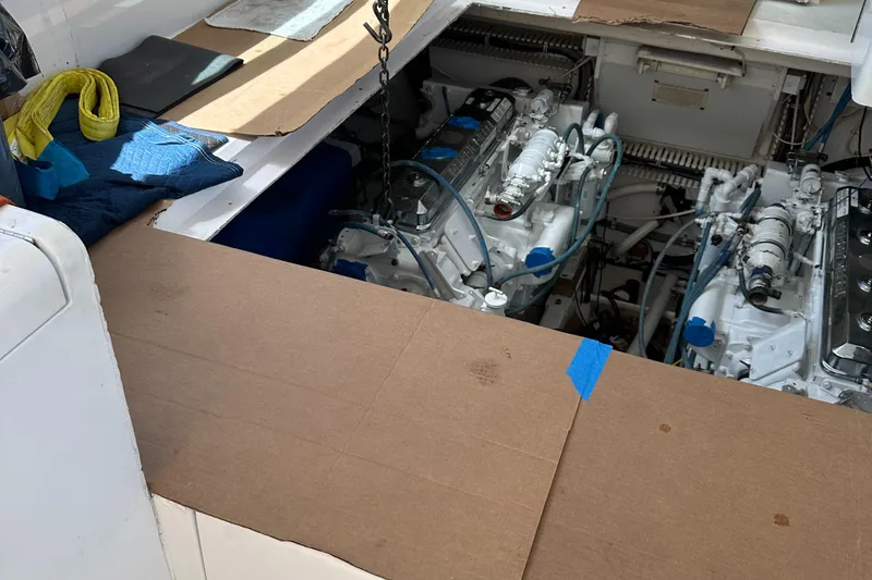 Slide: The Image of Engine compartment of 1998 Hatteras 39 Sport Express with visible twin engines. - 22