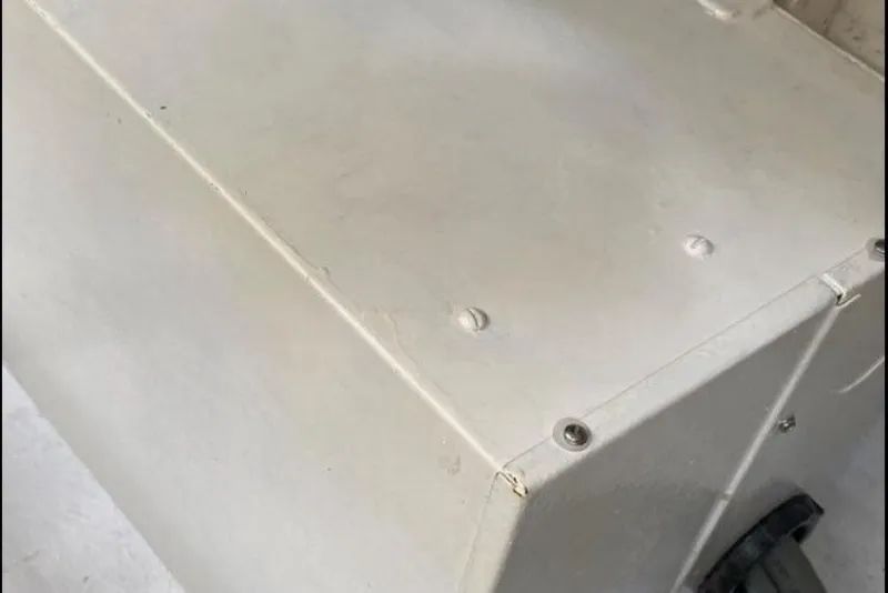 Slide: The Image of Close-up of a 1998 Hatteras 39 Sport Express boat component, showing a white, rectangular surface. - 23