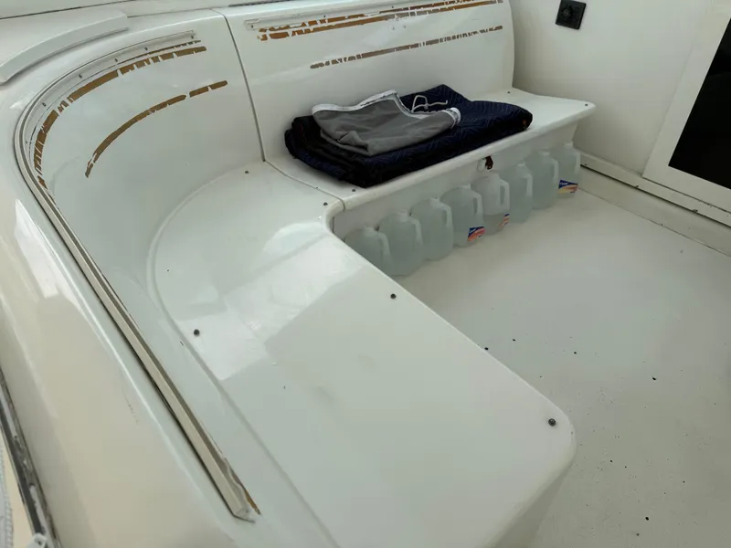 Slide: The Image of 1998 Hatteras 39 Sport Express boat interior with seating and storage area. - 6