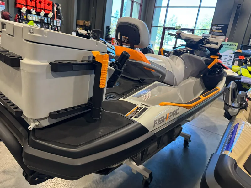 Slide: The Image of 2025 Sea-Doo Fishpro Trophy 170 jet ski displayed indoors, featuring fishing equipment. - 10