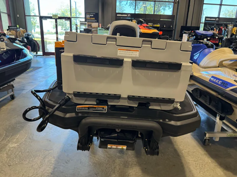 Slide: The Image of 2025 Sea-Doo Fishpro Trophy 170 in showroom, rear view with storage box. - 12