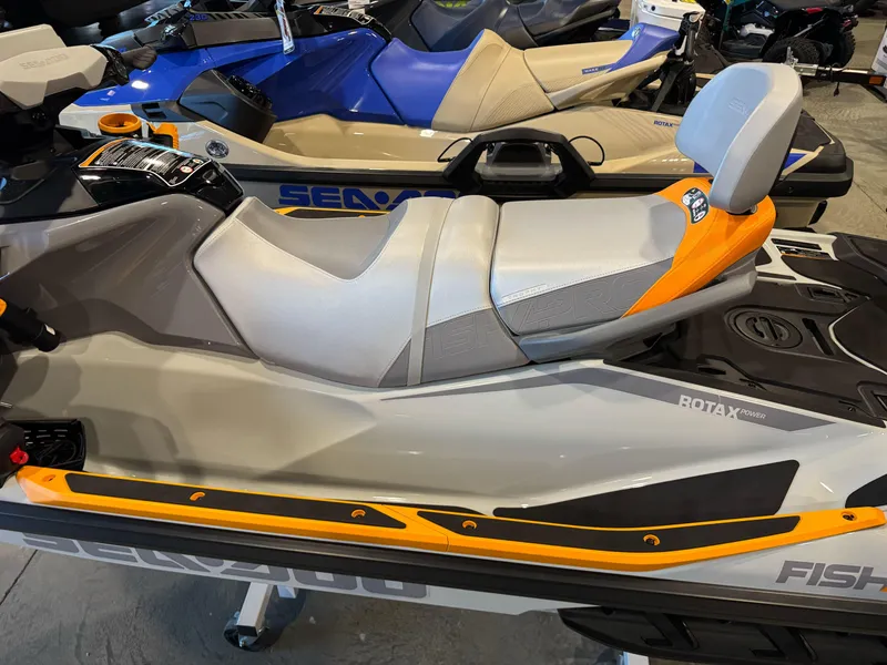 Slide: The Image of 2025 Sea-Doo Fishpro Trophy 170 jet ski with Rotax engine, gray and orange design. - 9