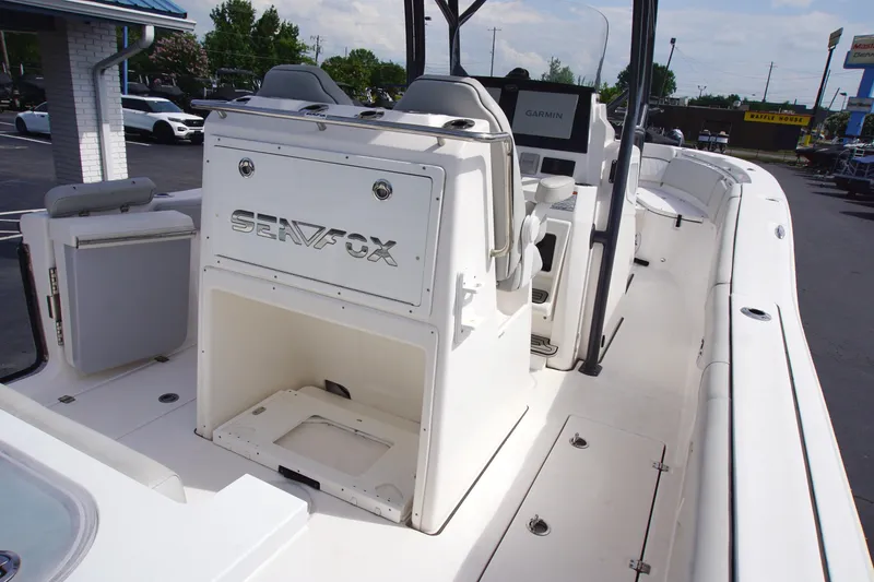 Slide: The Image of 2023 Sea Fox 288 Commander boat interior with seating and Garmin navigation system. - 11