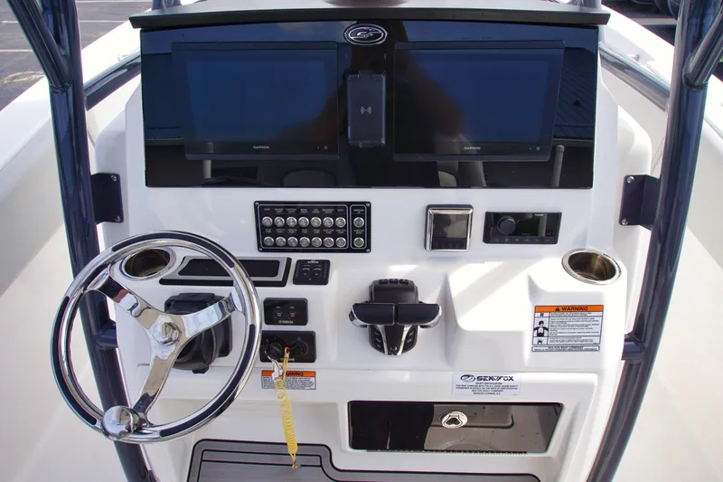 Slide: The Image of 2023 Sea Fox 288 Commander helm with dual Garmin displays and control panel. - 14