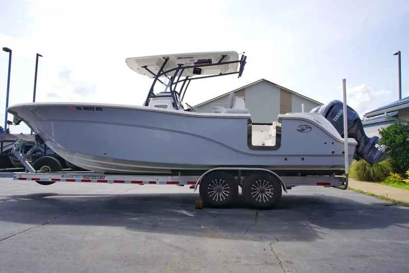 Slide: The Image of 2023 Sea Fox 288 Commander boat on trailer, side view, parked outdoors. - 4