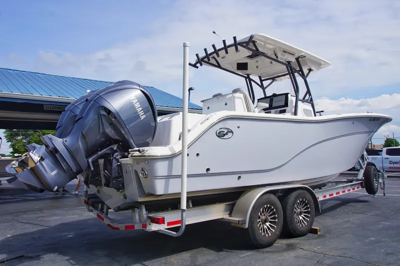 Slide: The Image of 2023 Sea Fox 288 Commander boat on trailer with Yamaha engines, parked outdoors. - 5