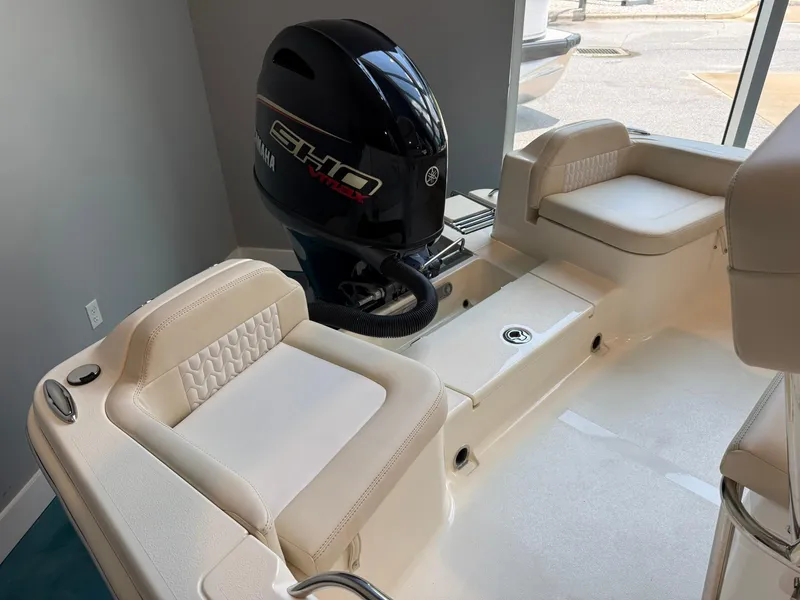 Slide: The Image of 2026 Scout 188 SF boat interior with Yamaha VMAX engine, featuring cushioned seating. - 17