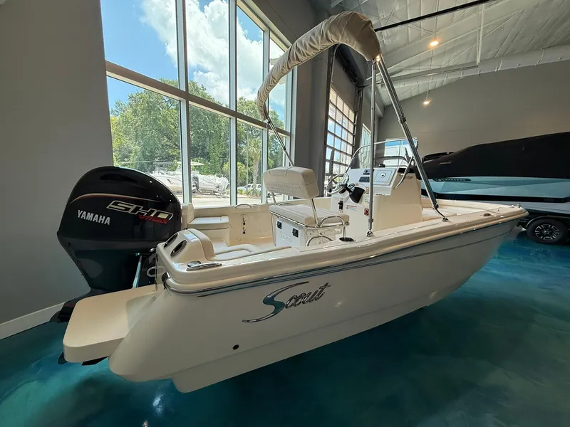 Slide: The Image of 2026 Scout 188 SF boat with Yamaha engine in showroom. - 2