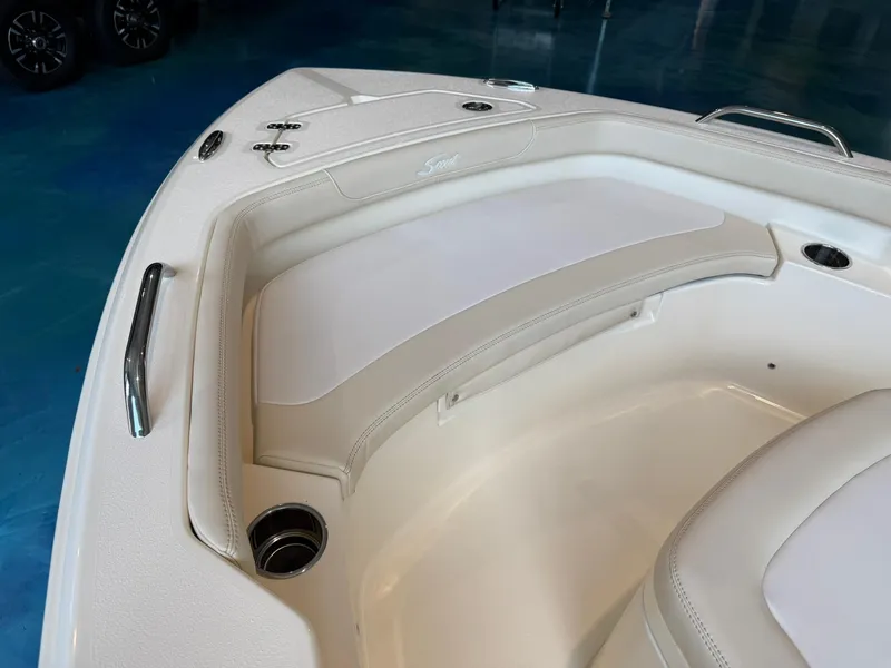 Slide: The Image of 2026 Scout 188 SF boat interior with white cushioned seating and stainless steel accents. - 5