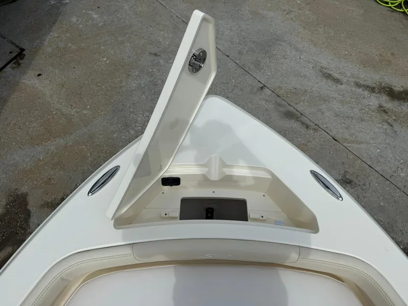 Slide: The Image of Open storage compartment on 2026 Scout 188 SF boat deck. - 7