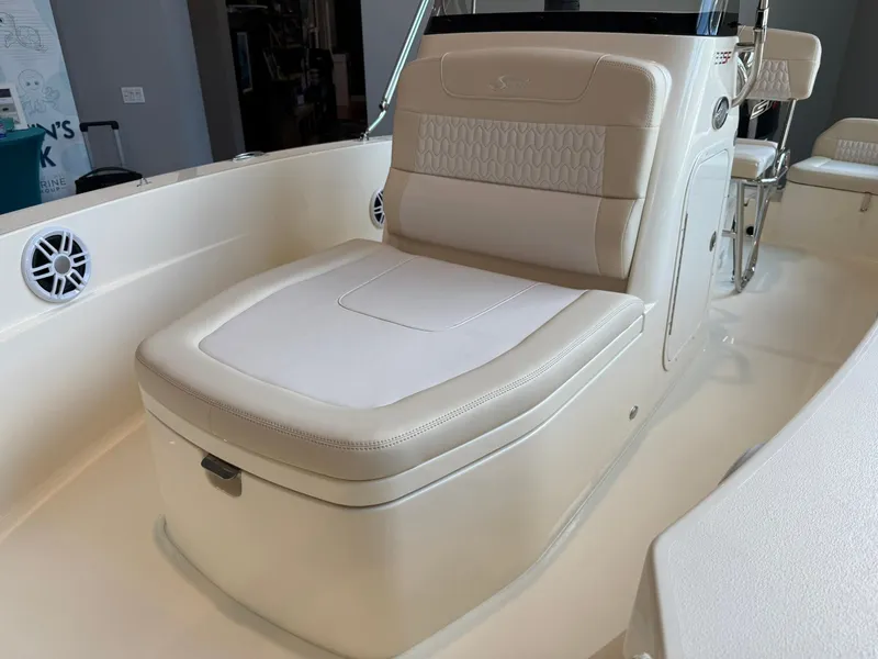 Slide: The Image of 2026 Scout 188 SF boat interior with cushioned seating and built-in speakers. - 8