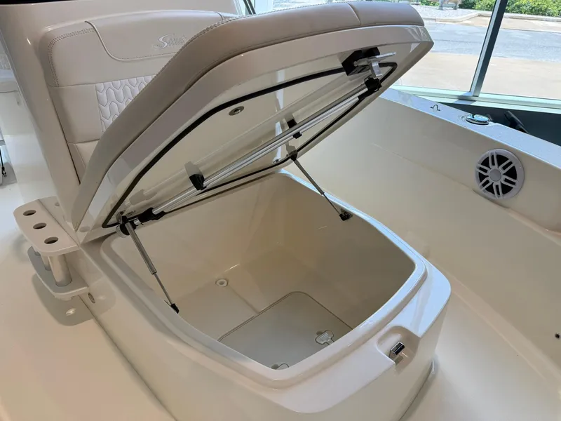 Slide: The Image of 2026 Scout 188 SF boat storage compartment open, showcasing interior space and design. - 9