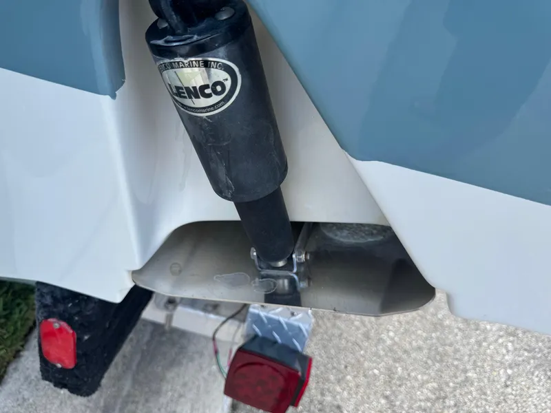 Slide: The Image of Close-up of a 2019 Sea Hunt Ultra 275 SE boat's Lenco trim tab actuator. - 10