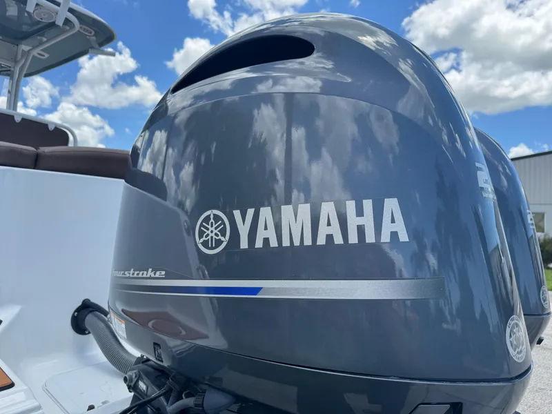 Slide: The Image of Yamaha outboard motor on 2019 Sea Hunt Ultra 275 SE boat under blue sky. - 13