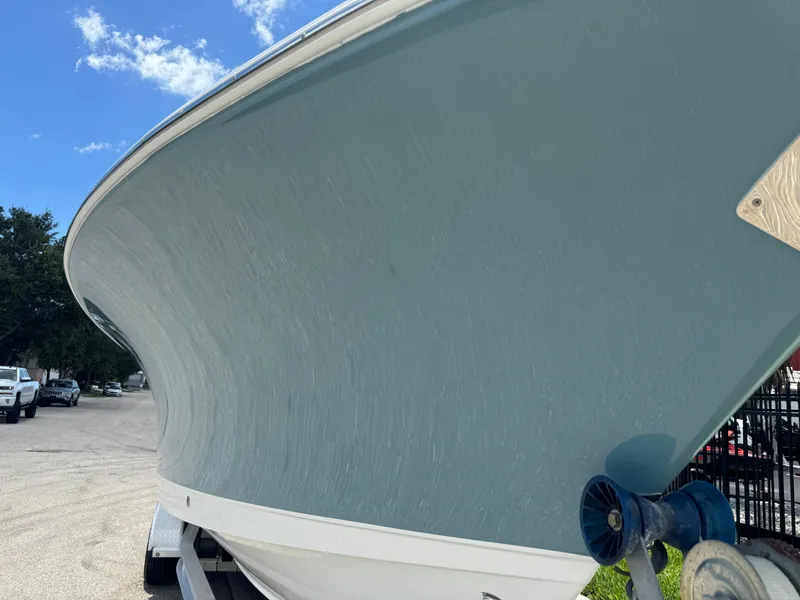 Slide: The Image of 2019 Sea Hunt Ultra 275 SE boat on trailer under blue sky. - 23