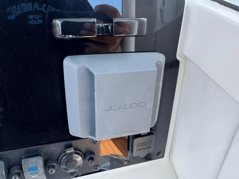 Slide: The Image of JL Audio system on a 2019 Sea Hunt Ultra 275 SE boat dashboard. - 30
