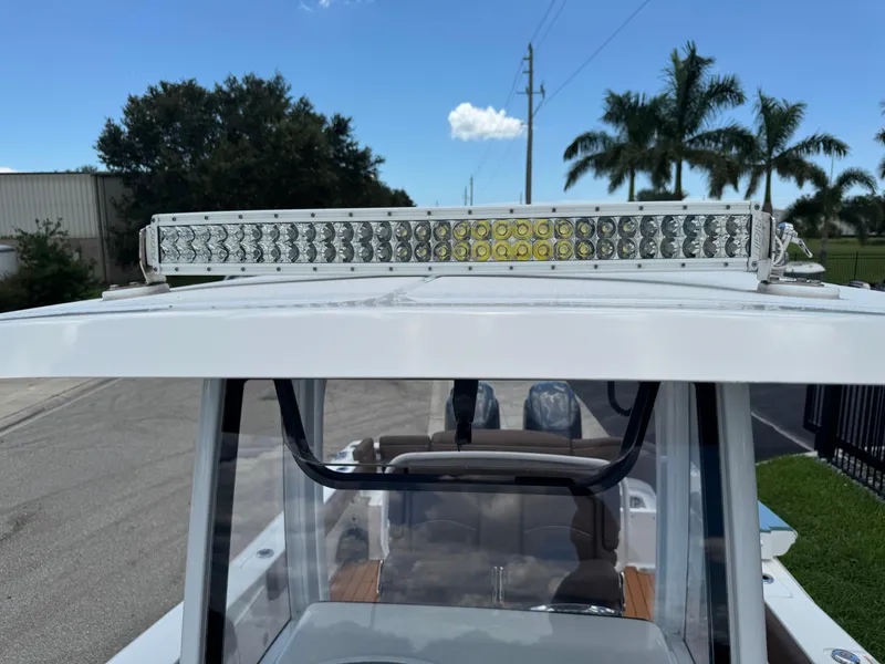 Slide: The Image of 2019 Sea Hunt Ultra 275 SE boat with LED light bar on top. - 49