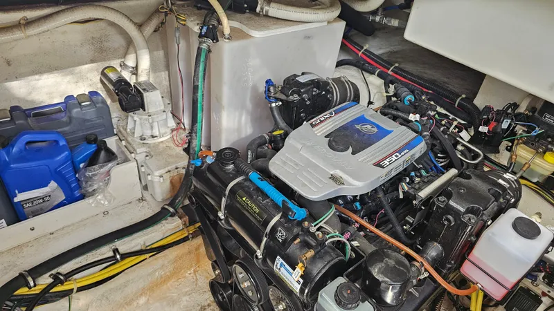 Slide: The Image of Engine compartment of a 2009 Bayliner 340 SB boat, featuring a 350 MAG engine. - 29