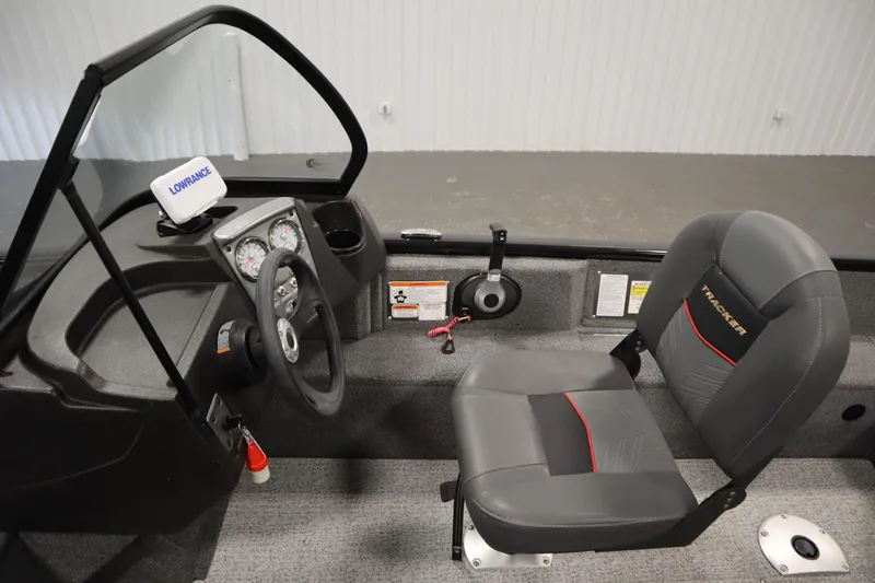 Slide: The Image of 2023 Tracker V16 Pro Guide WT boat interior with steering wheel and seat. - 11