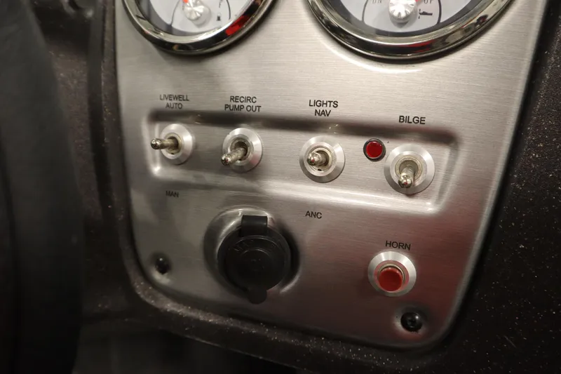 Slide: The Image of Control panel of 2023 Tracker V16 Pro Guide WT boat with switches and gauges. - 17