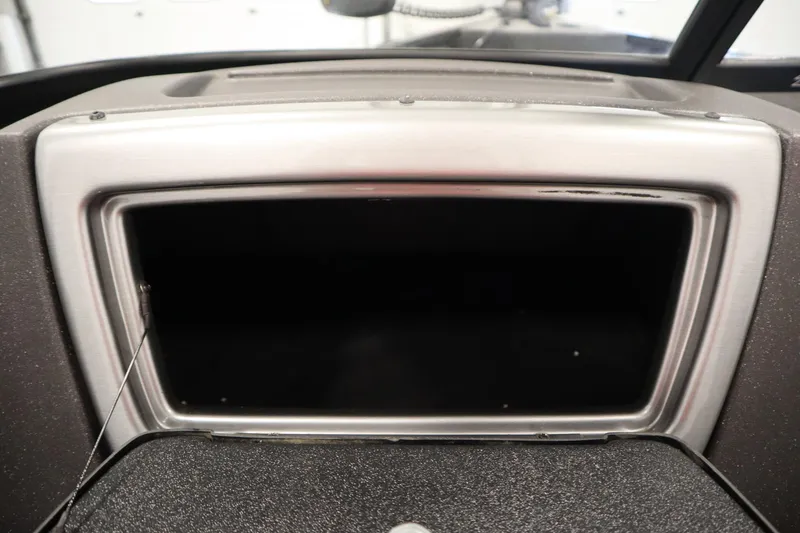 Slide: The Image of 2023 Tracker V16 Pro Guide WT dashboard compartment, open and empty. - 24