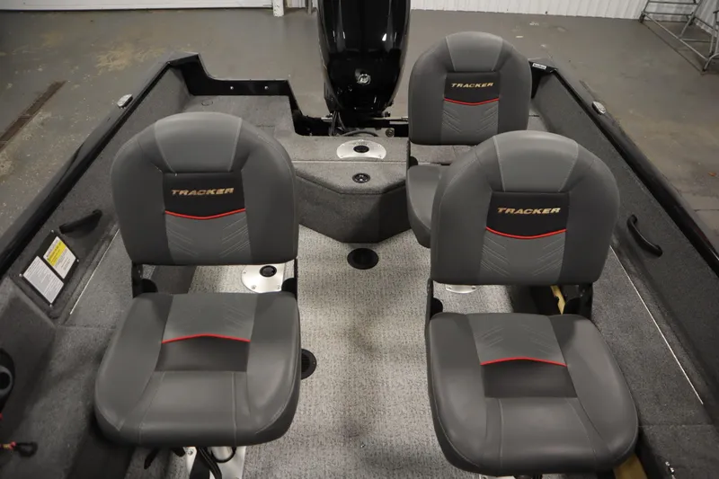 Slide: The Image of 2023 Tracker V16 Pro Guide WT boat interior with four gray seats. - 28