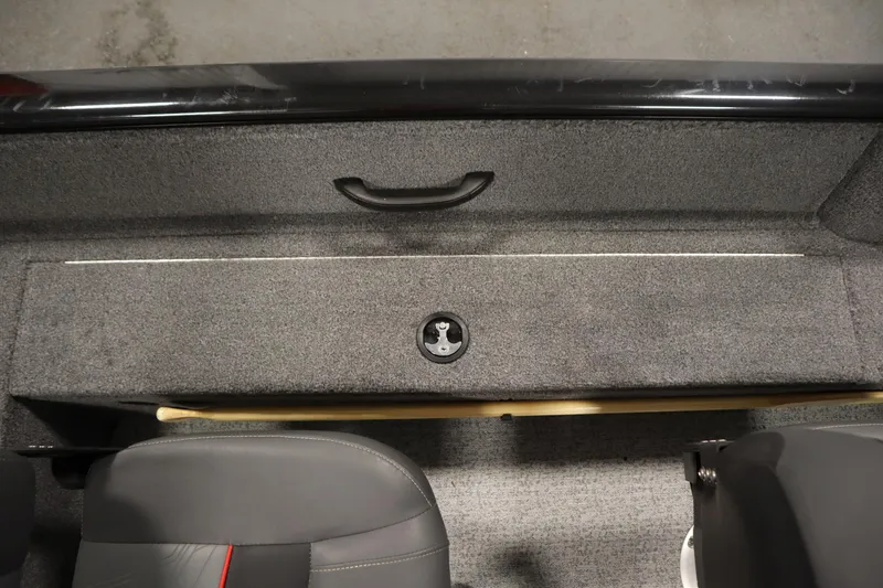 Slide: The Image of 2023 Tracker V16 Pro Guide WT boat interior with gray carpet and seating. - 31