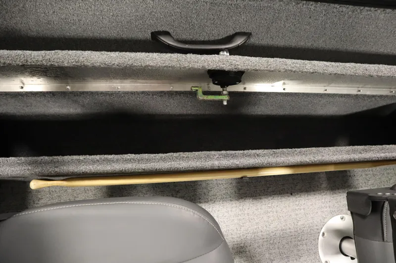 Slide: The Image of 2023 Tracker V16 Pro Guide WT boat interior storage compartment with handle and seat. - 32