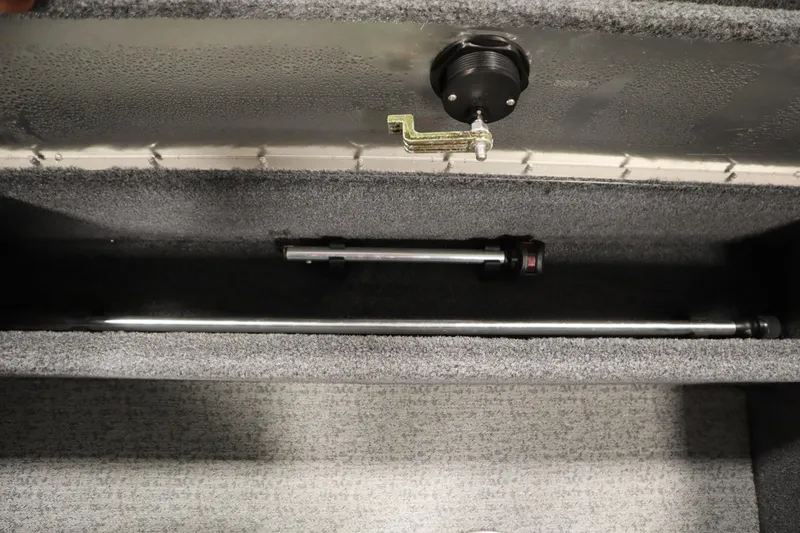 Slide: The Image of 2023 Tracker V16 Pro Guide WT storage compartment with rod holder and latch. - 34