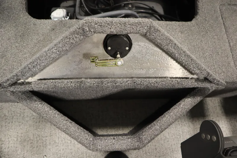 Slide: The Image of 2023 Tracker V16 Pro Guide WT boat interior with carpeted storage compartment. - 37