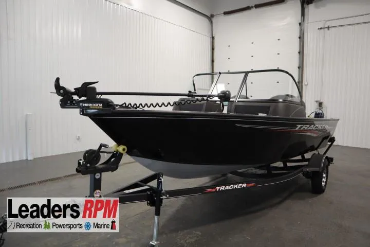Slide: The Image of 2023 Tracker V16 Pro Guide WT boat in showroom, Leaders RPM logo visible. - 40
