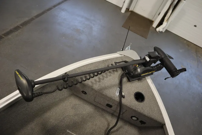 Slide: The Image of 2013 Alumacraft 165 Classic SC boat with trolling motor on deck. - 11