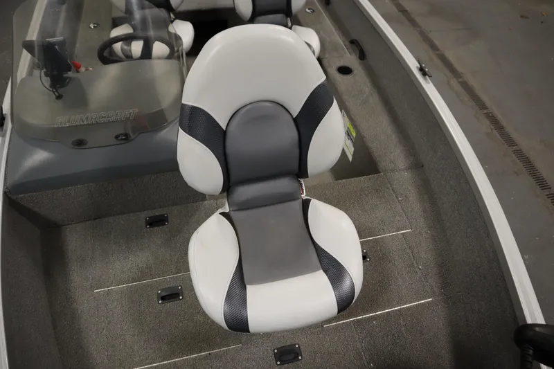 Slide: The Image of 2013 Alumacraft 165 Classic SC boat interior with gray and white seating. - 18