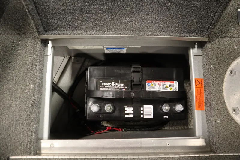 Slide: The Image of Battery compartment of 2013 Alumacraft 165 Classic SC boat, featuring Fleet Farm battery. - 20