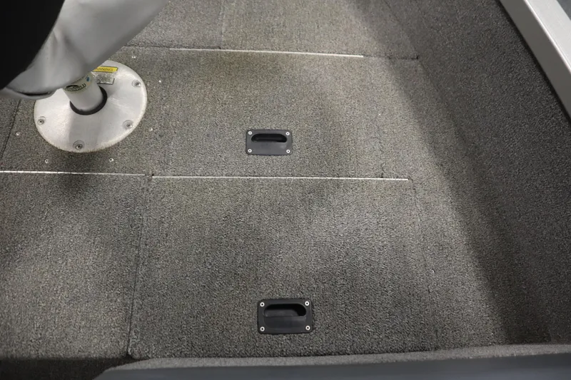 Slide: The Image of 2013 Alumacraft 165 Classic SC boat interior with carpeted floor and seat base. - 22