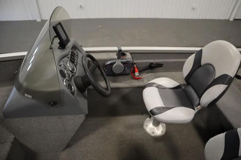 Slide: The Image of 2013 Alumacraft 165 Classic SC boat interior with steering console and seat. - 26
