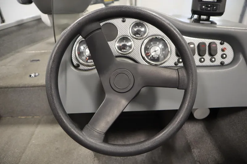 Slide: The Image of Steering wheel and dashboard of 2013 Alumacraft 165 Classic SC boat. - 28