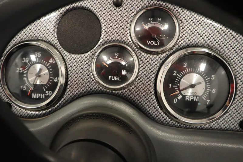 Slide: The Image of Dashboard of 2013 Alumacraft 165 Classic SC with speedometer, fuel, volt, and RPM gauges. - 30