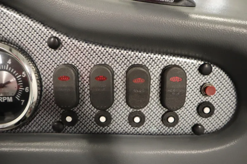 Slide: The Image of Dashboard controls of a 2013 Alumacraft 165 Classic SC boat. - 31