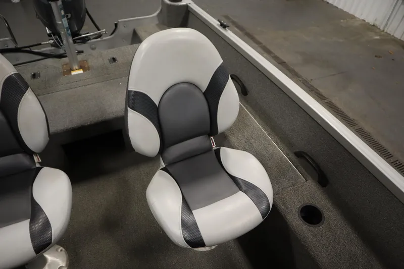 Slide: The Image of 2013 Alumacraft 165 Classic SC boat interior with two gray and white seats. - 34