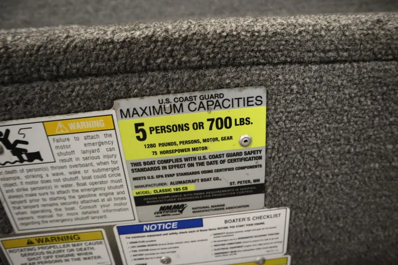 Slide: The Image of 2013 Alumacraft 165 Classic SC capacity label: 5 persons or 700 lbs, 75 horsepower motor. - 35