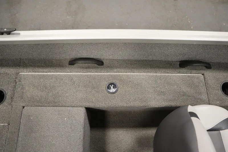 Slide: The Image of 2013 Alumacraft 165 Classic SC boat interior with carpeted flooring and seating. - 36