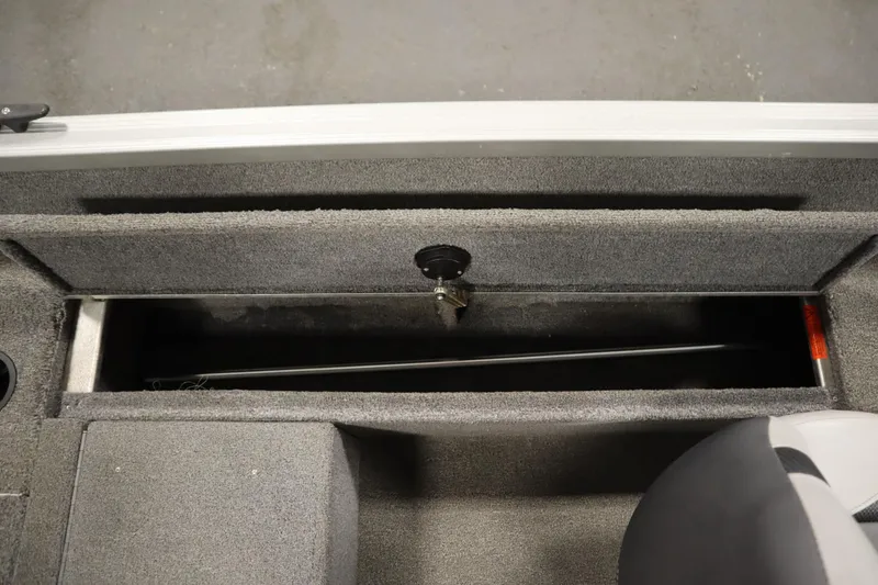 Slide: The Image of 2013 Alumacraft 165 Classic SC boat storage compartment, open and empty. - 37