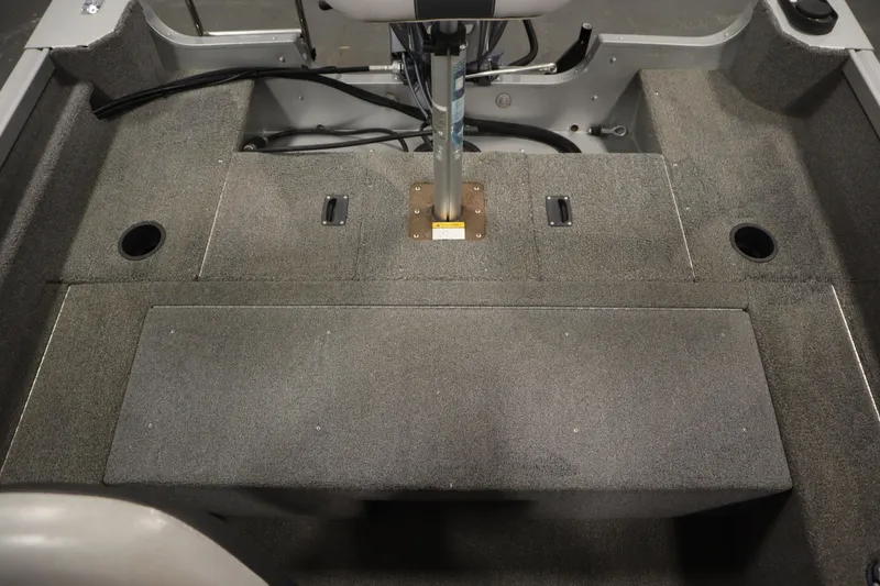 Slide: The Image of 2013 Alumacraft 165 Classic SC boat interior with carpeted deck and seat base. - 40