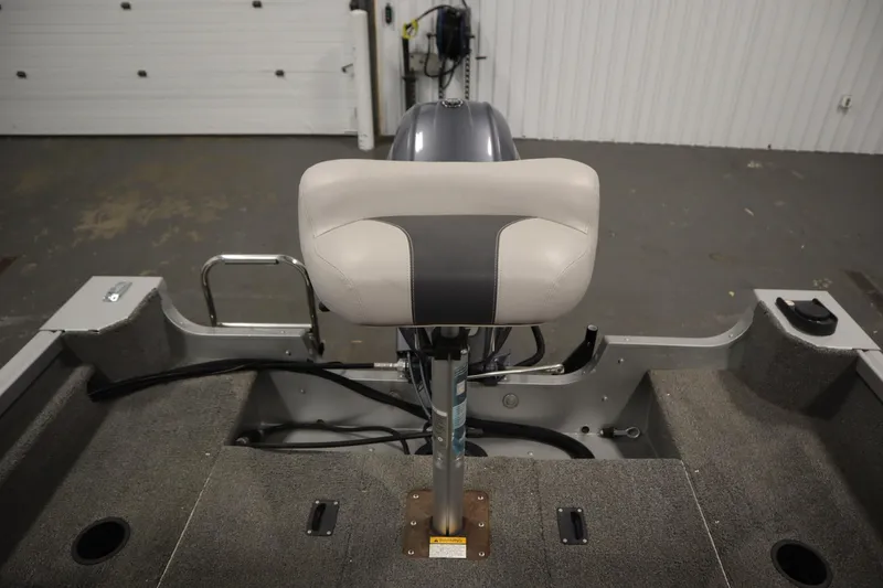 Slide: The Image of 2013 Alumacraft 165 Classic SC boat interior with seat and motor view. - 42